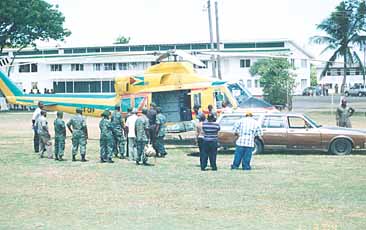 Soldiers removing Private Kwesi Toddxs body from the helicopter yesterday morning.